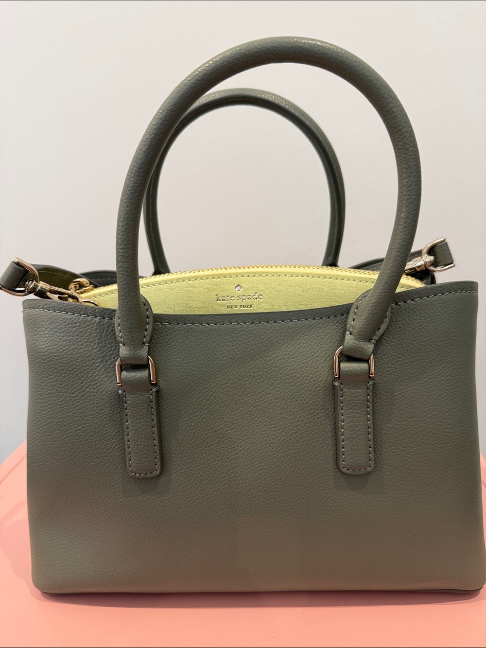 kate spade
olive green leather satchel with yellow interior trim